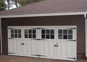 Oympic 6 lite carriage door transforms a typical rambler style home.