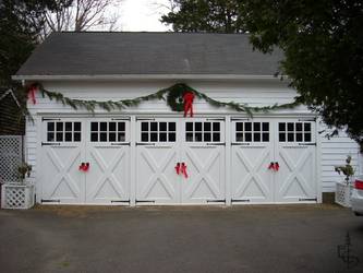 Olympic style 8 lite doors restore this 100 year old carriage house.