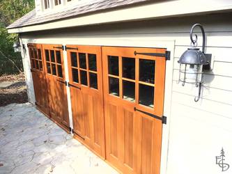 Carriage doors on detached carriage house.